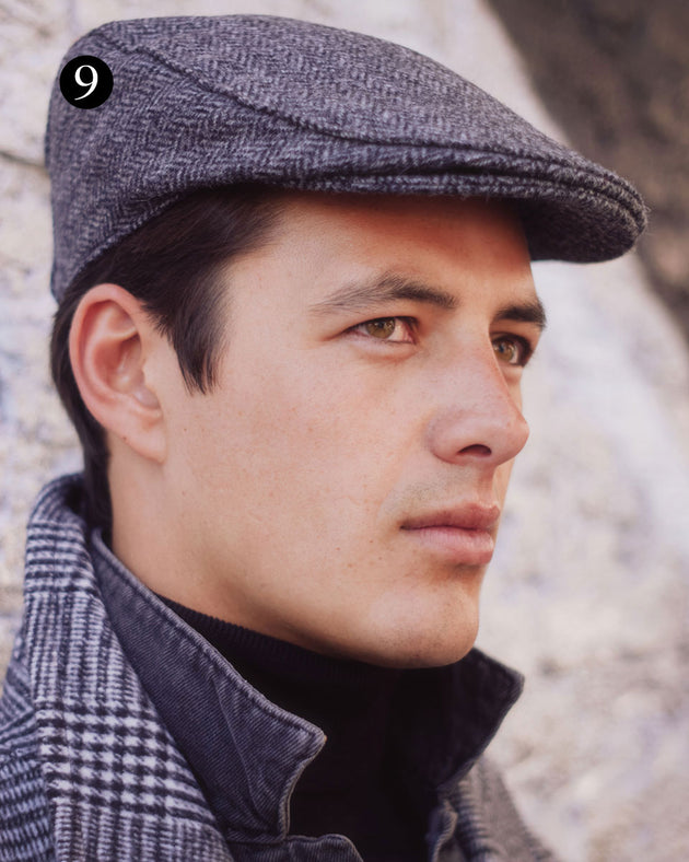 Man wearing tweed flat cap in charcoal out in the city
