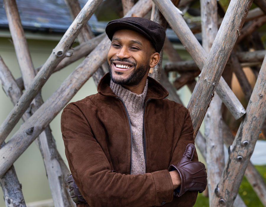 Man wearing a brown flat cap outdoor