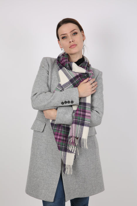 Woman wearing a Heritage plaid check cashmere scarf in ivory