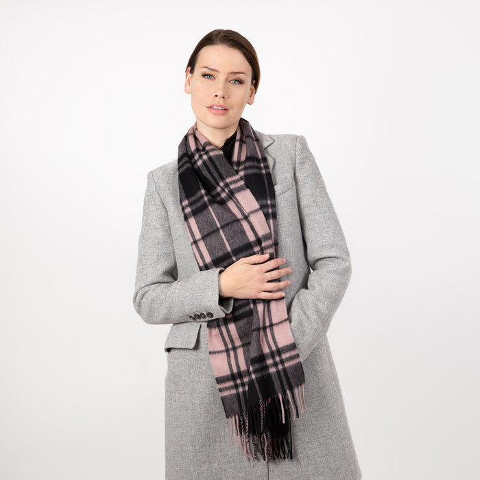 Woman wearing Heritage plaid check cashmere scarf in blush