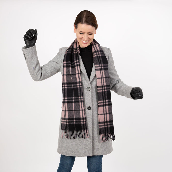 Woman wearing Heritage plaid check cashmere scarf in blush