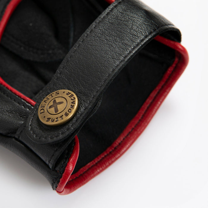 Men's The Suited Racer touchscreen leather driving gloves with wristwatch cut out in black/berry close up of the strap