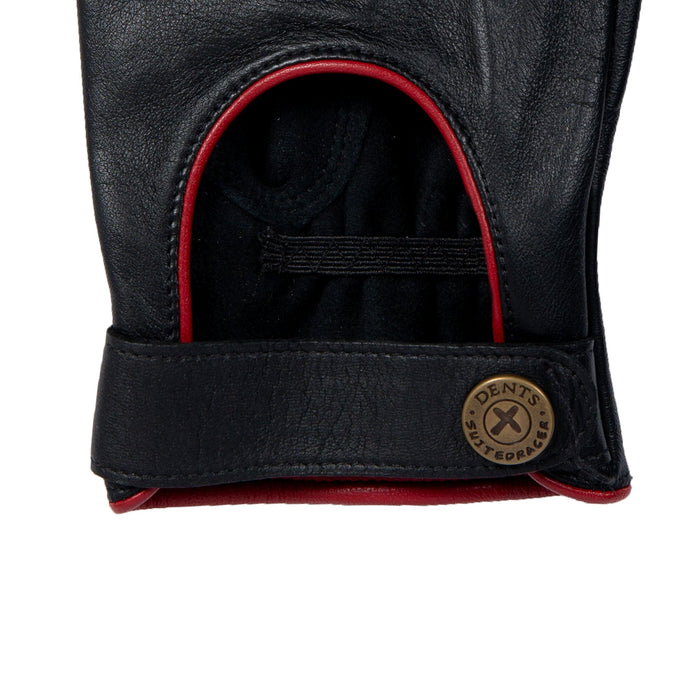 Men's The Suited Racer touchscreen leather driving gloves with wristwatch cut out in black/berry in close up of the cuff with a strap 