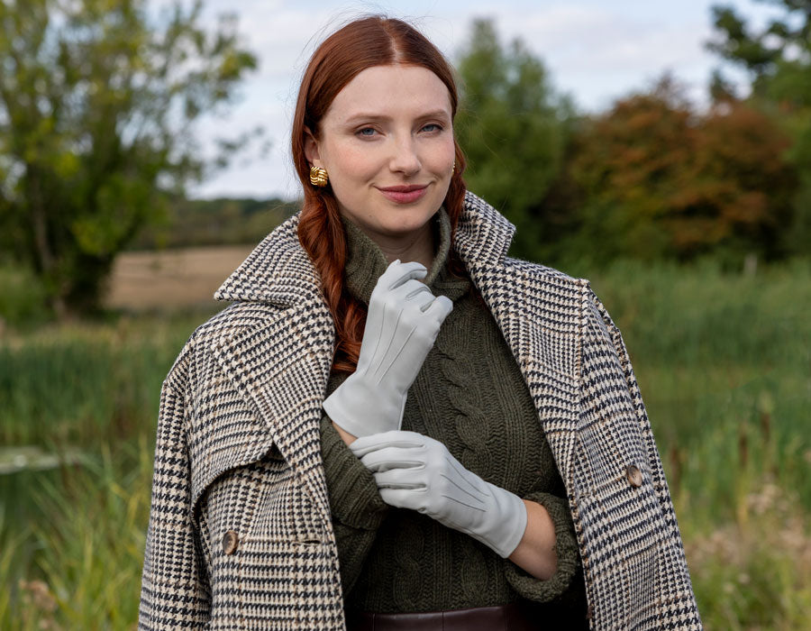 Woman wearing leather gloves in silver outdoors