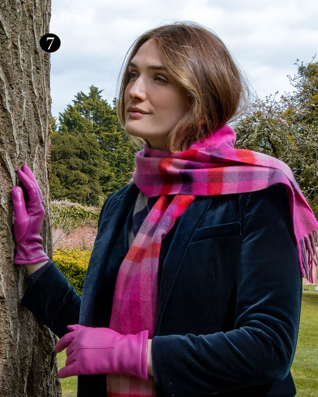 Woman wearing hot pink single point lined leather gloves 