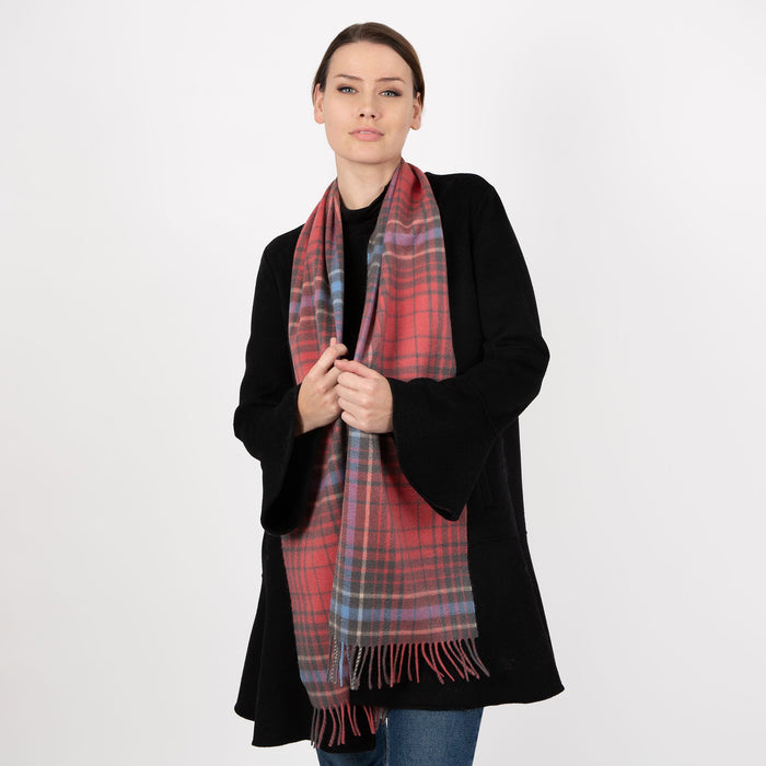 Woman wearing cashmere check plaid scarf in lobster