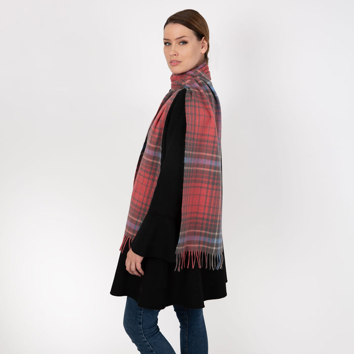 Woman wearing cashmere check plaid scarf in lobster