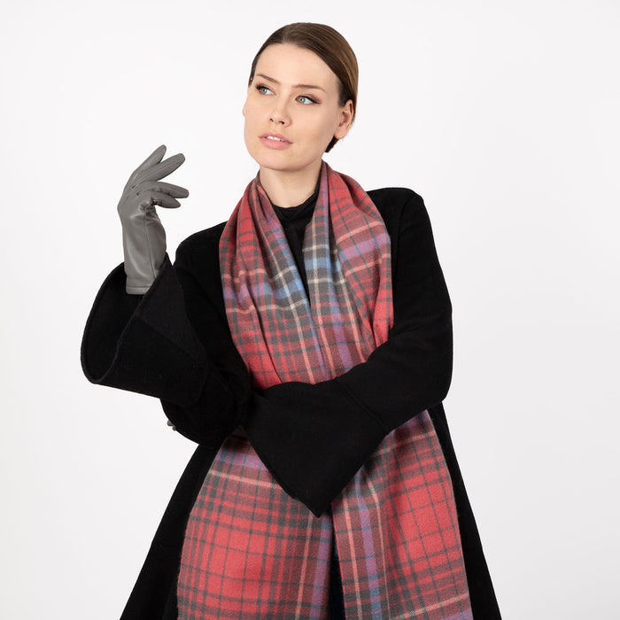 Woman wearing cashmere check plaid scarf in lobster