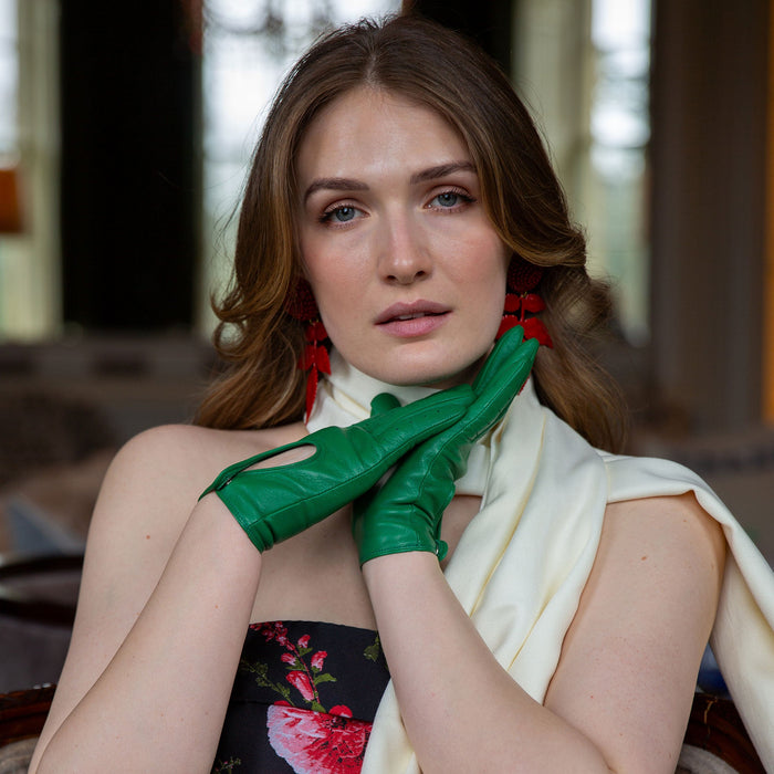 Woman wearing leather driving gloves in emerald with a pashmina at a state home