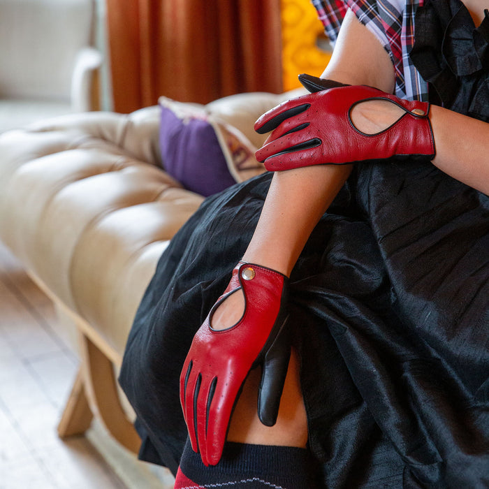 Woman wearing Berry Black leather touchscreen driving gloves 