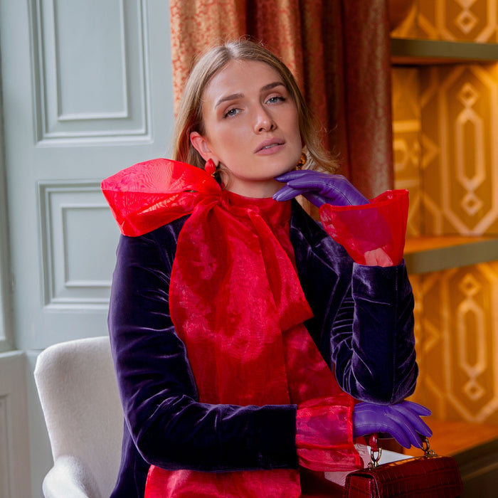 Woman wearing Women's Amethyst Three Point Lined Leather Gloves in a grand house