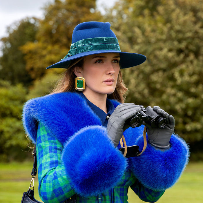 Woman wearing Women's Charcoal Three Point Lined Leather Gloves in a park with binoculars