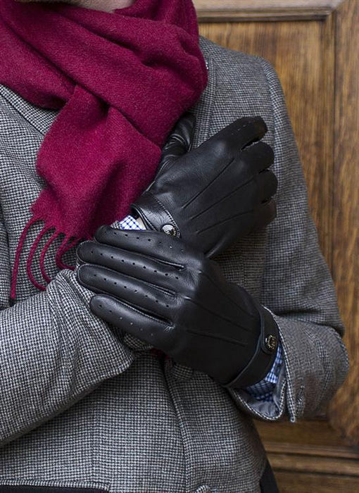Man wearing mens black three point leather driving gloves